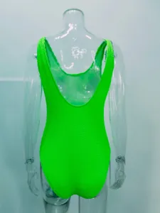 Neon green one piece swimsuit detail view, textured bubble fabric, low back design for women.