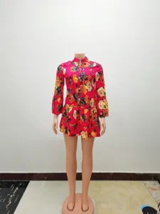 Floral print detail and tiered ruffled hem of the red vintage long sleeve mini dress.