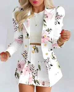Close-up detail showing the floral print blazer and button design for autumn fashion style.