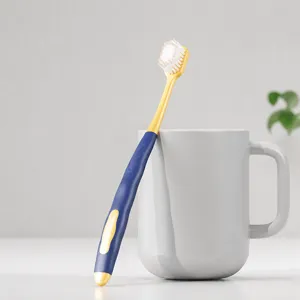 Ergonomic toothbrush with soft wide head and anti-slip silicone handle for daily care.
