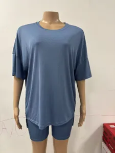 Detailed view of casual solid color ribbed short sleeve top and matching shorts pajama set.