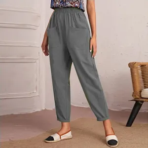 Detail shot of women's grey casual pants featuring elastic high waist and side pockets for daily wear.