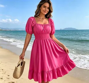 Pink square neck puff sleeve midi dress detail showcase view on sunny beach background