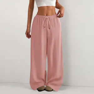 Vista dettagliata dei pantaloni casual larghi da donna tinta unita testurizzati con coulisse.