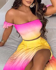 Detail shot of women's gradient off-shoulder crop top and high slit skirt two-piece set.