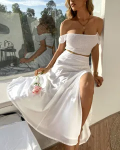 White off-shoulder crop top and high slit skirt two piece set, elegant summer fashion outfit.