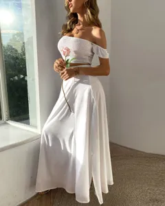 White off-shoulder crop top and long skirt set, elegant summer vacation style detail view.