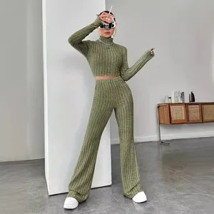 Olive green ribbed knit two-piece set, long sleeve crop top and flare pants for women.