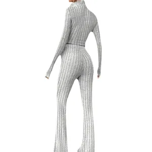 Grey ribbed knit two-piece set featuring a turtleneck long sleeve top and flare pants for women.