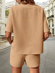 Detailed back view of women casual two piece set in khaki, with textured fabric for daily use.