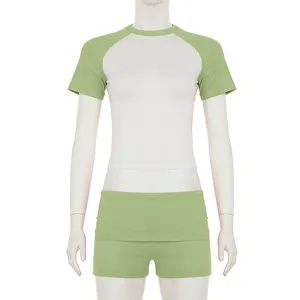 Women athletic raglan crop top and shorts set, comfortable color block activewear outfit.