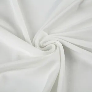 Close-up detail of white sportswear fabric showing soft texture and fine knit weave.
