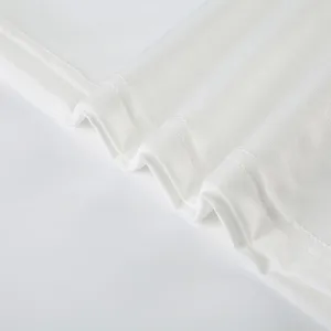 Detailed close-up view of white fabric showing fine texture and clean stitched hem.
