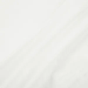 Close-up detail of pure white fabric material with smooth drape texture and clean look.