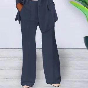 Detailed view of women's stylish solid color suit trousers and blazer set, elegant fit.