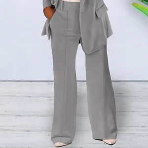 Detailed view of women's solid color slim blazer and pants suit set for elegant daily wear.