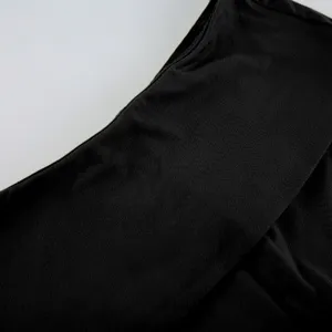 Black fabric texture close up showing fine material details and neat stitching craftsmanship.