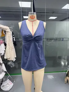 Sleeveless V-neck tank top featuring a stylish front twist knot and fitted ruched waist detail.