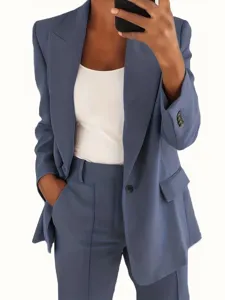 Detailed view of the stylish solid color slim fit blazer and pants suit for women.