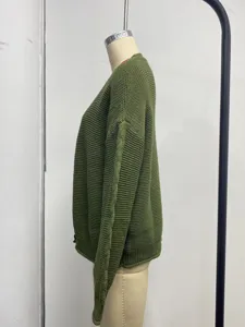 Green knitted cardigan detail, side view of casual long sleeve sweater, relaxed fit.