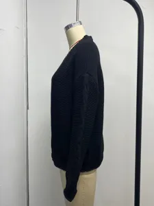 Black knit cardigan side view detail, casual open front sweater for women, cozy knitwear.