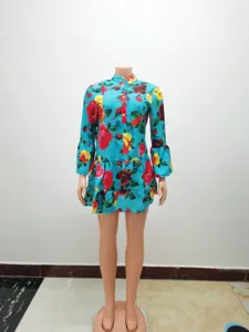 Women's vintage floral print long sleeve mini dress with tiered ruffle hem and button up.
