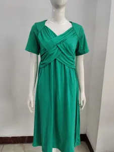 Elegant green midi dress featuring a stylish crossover pleated bodice and short sleeves.