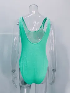 Fluorescent green crinkle fabric one-piece swimsuit back view detail showcasing the texture.