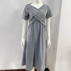 Detail view of a stylish grey short sleeve midi dress featuring elegant crossover V-neck design.