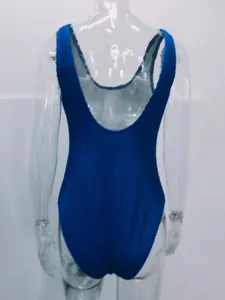 Blue textured crinkle one-piece swimsuit for women, elegant backless design details.