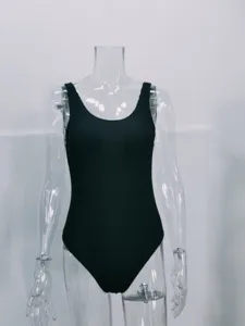 Black one-piece swimsuit featuring textured crinkle fabric and classic scoop neck design.