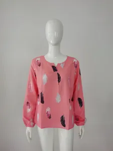 Pink long sleeve V-neck top detail, feather print pattern and relaxed loose fit style.