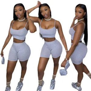 Women casual grey crop top and biker shorts two piece set, sleeveless basic summer outfit.