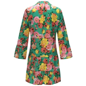Back view details of women's vintage floral print tiered dress with half-open collar and long sleeves.