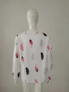 Back view detail of women long sleeve white top with stylish colorful feather print pattern.