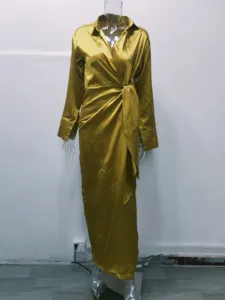 Satin long sleeve lapel wrap maxi dress detail, golden elegant high waist split design.