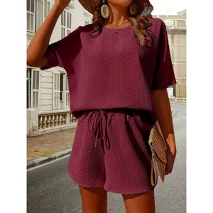 Womens waffle knit two piece set featuring a casual short sleeve top and matching shorts.