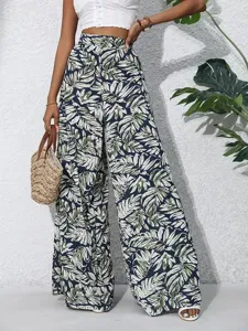 Detail view of tropical leaf print high waist wide leg pants, perfect for summer resort wear.