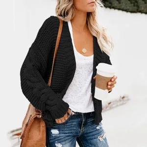 Close-up detail view of women's black knitted cardigan showcasing texture and casual fit.