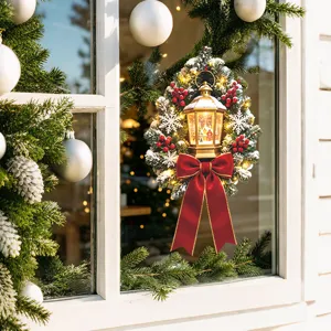 Detailed Christmas wreath window sticker featuring a golden lantern and red velvet bow