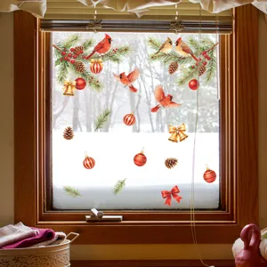Detail of Christmas window stickers featuring cardinals, pine cones, and ornaments.