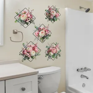 Detail view of pink flower wall decals with black diamond frames in a bathroom setting