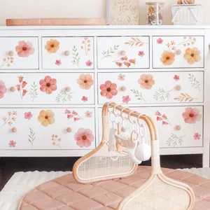 Nursery room scene featuring low saturation pink and orange floral furniture stickers