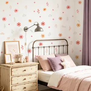 Cozy bedroom scene showing pink and orange floral wall stickers on a white wall