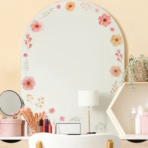 Floral wall stickers in soft pink and orange tones decorating a vanity mirror