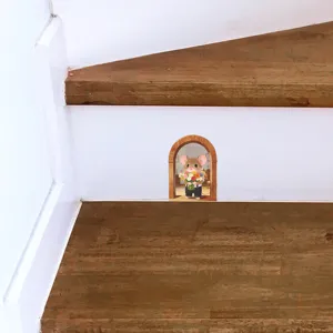 Detailed view of fairy tale mouse holding flowers 3D wall sticker on a wooden staircase