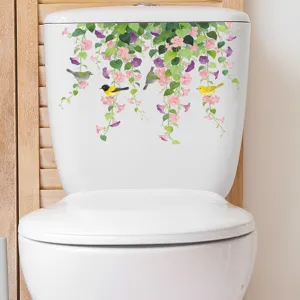 Hängende Blumenranke und Vogel Wandaufkleber auf einem weißen Toilettenspülkasten