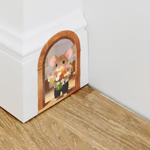Detailed close-up view of a cute 3D mouse hole wall decal on white skirting board