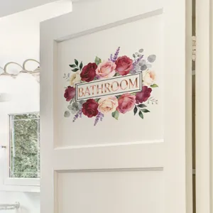 Detailed view of a floral bathroom wall decal with elegant roses and 'BATHROOM' lettering