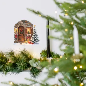 Macro detail view of a cozy Christmas stone house wall sticker on a white wall decor